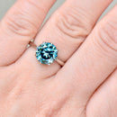 Blue gemstone ring on a hand