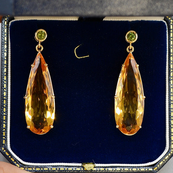 A pair of 9ct gold citrine and green tourmaline drop earrings in a blue velvet box