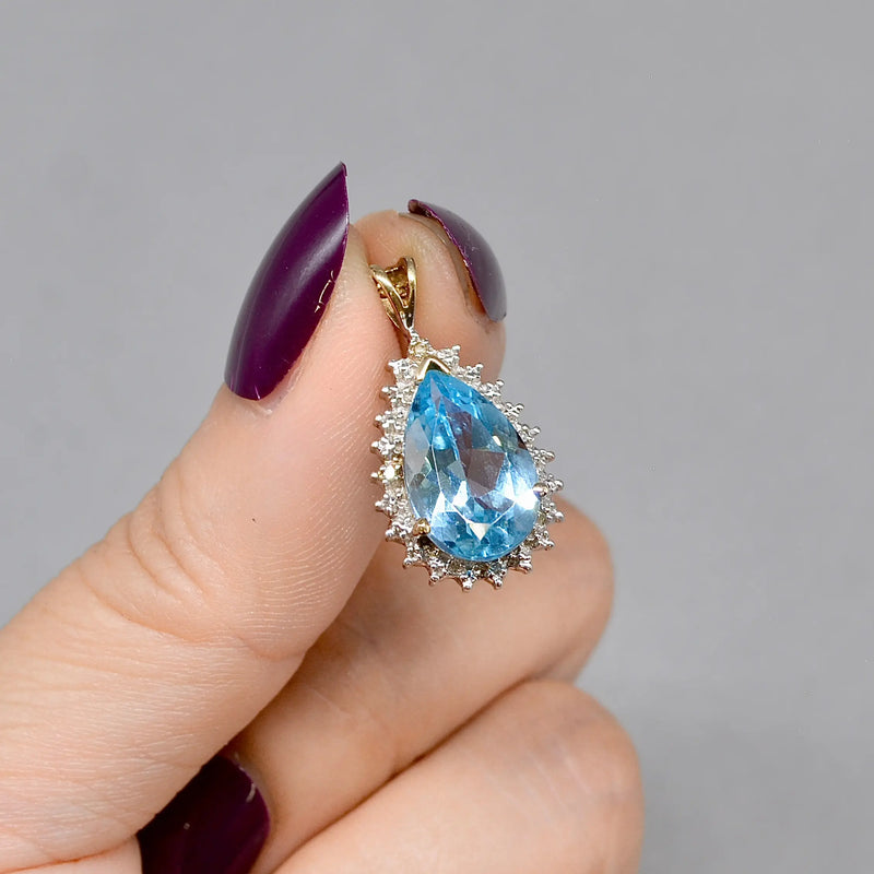 Swiss Blue Topaz and Diamond Halo Pendant With 9ct Yellow Gold Chain