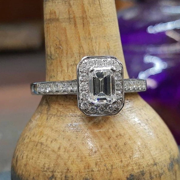 Emerald cut Diamond and white gold cluster ring