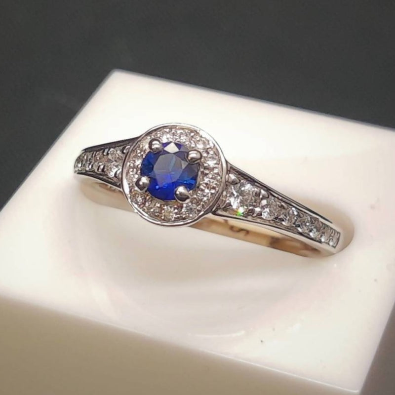 18CT White Gold Sapphire & Diamond Halo Ring