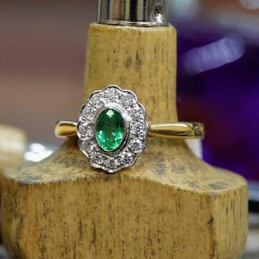 Emerald and emerald cut GVS diamond cluster ring