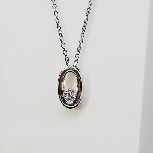 white gold diamond oval shape pendant and necklace
